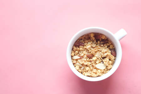 cereal breakfast in bowl on pink backgroundの写真素材