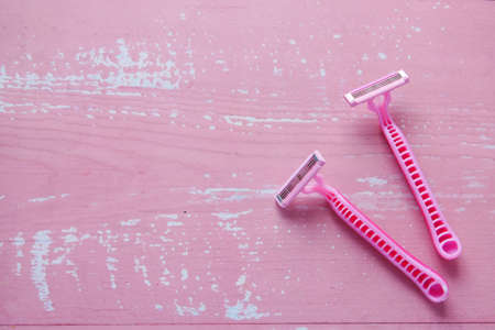 close up of pink color razor on table ,の写真素材