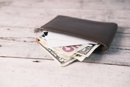 close up of wallet, cash and credit card on tableの写真素材