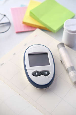 diabetic measurement tools on a planner on tableの写真素材