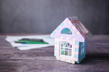 the concept of finance concept with model house and paperの写真素材
