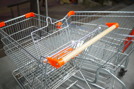 empty shopping trolley left outside of a market