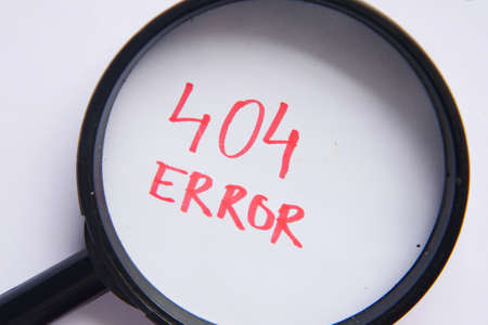 magnifying glass inspecting 404 error close upの写真素材