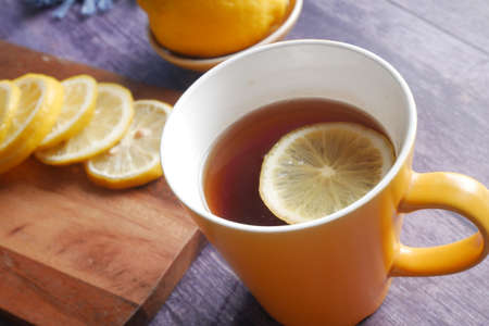 Close up of lemon tea on wooden background.の写真素材