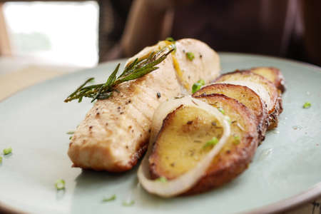 tasty salmon, mash potato and vegetable on plateの写真素材