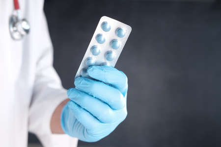 doctor hand holding blister pack with copy spaceの写真素材