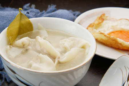 Dumpling Soup in a bowl on table,の写真素材
