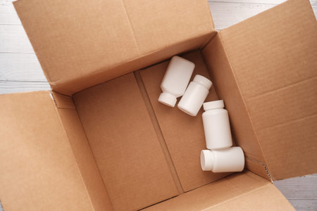 medical pill containers in open a box