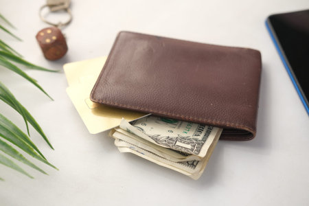 close up of wallet, cash and credit card on table