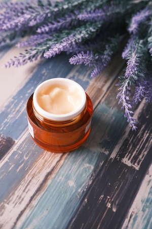 herbal cream cosmetic in a container on table,の写真素材