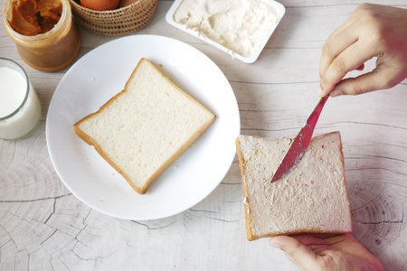 low fact cheese cream spread on a bread on table