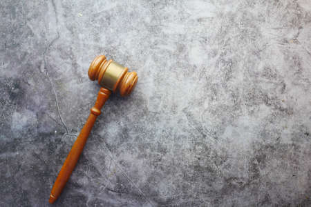Top view of gavel on black background with copy spaceの写真素材