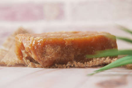 stack of Jaggery traditional cane sugar cube on tableの写真素材
