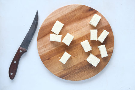 top view of cube shape fresh cheese on white background.の写真素材