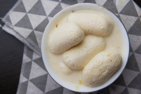 close up of indian sweet in a bowl on table.の写真素材