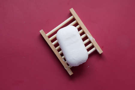 Soap and bubbles on a case on color backgroundの写真素材