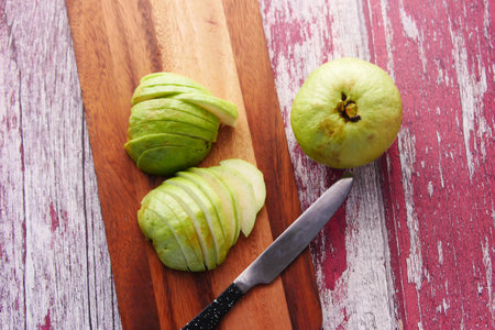 close up of slice of guava on a chopping board ,の写真素材