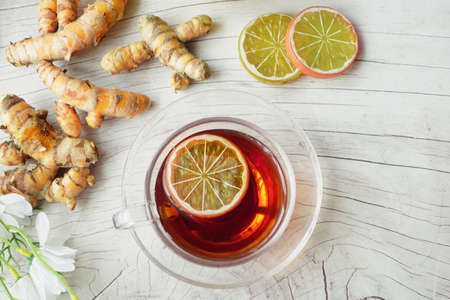 Top view of ginger tea on wooden background.の写真素材