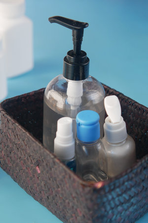close up of many hand sanitizer in a box on tableの写真素材