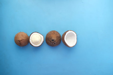 slice of fresh coconut on a blue background