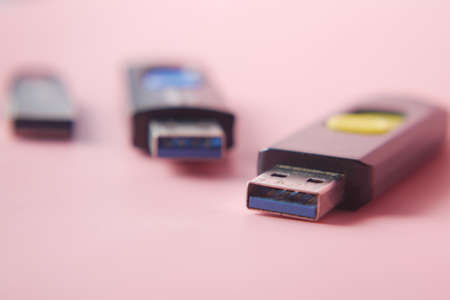USB flash drive on blue background close upの写真素材