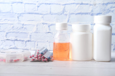 many medical pill container on table