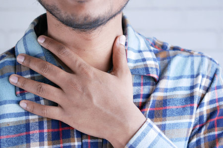 unrecognized man suffering throat pain close up