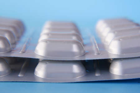 Close up of pills of blister pack on tableの写真素材
