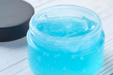 close up of jar of hair gel on tableの写真素材