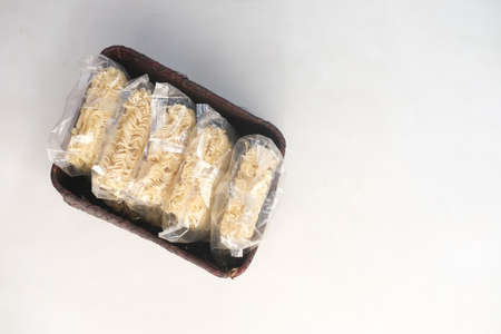 Noddle packet in a box on white backgroundの写真素材