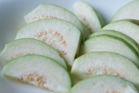close up of slice of guava on tableの写真素材