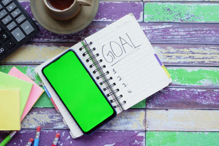 2022 new year goals on notepad on table ,の写真素材