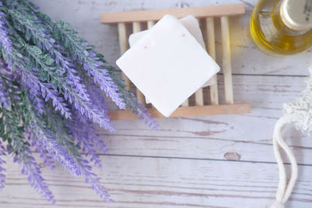Homemade natural soap bar and dry flower on black backgroundの写真素材