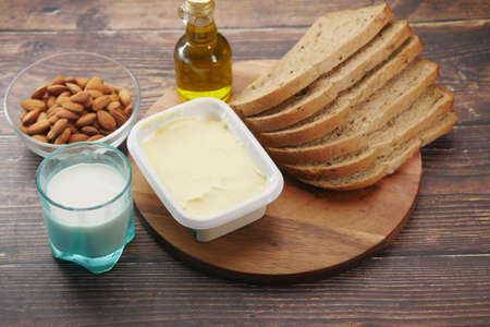 soft butter spread and breads on tableの写真素材