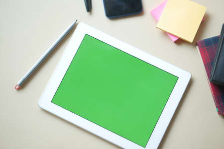 Flat composition of digital tablet and office stationary on black backgroundの写真素材