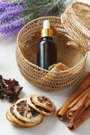 essential citrus oil, dried lemon and spice on table ,の写真素材