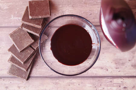 dark chocolate cream in a bowl on whiteの写真素材