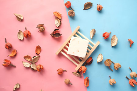 Homemade natural soap bar and dry flower on black backgroundの写真素材