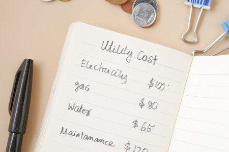 list of utility bills on a paper on tableの写真素材