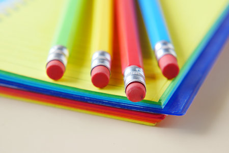 Close up of colorful pencils on notepadの写真素材
