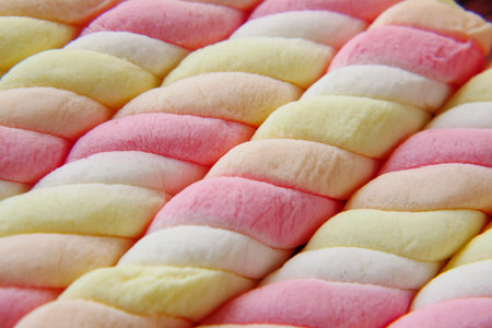 marshmallow candy in a bowl on blueの写真素材