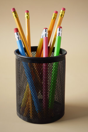 colorful pencils in a box on tableの写真素材