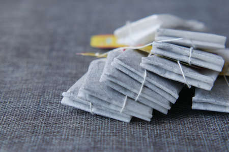 tea bag with small bag on table close upの写真素材