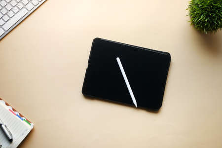 top view of digital tablet and graphic on tableの写真素材