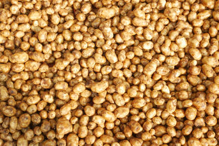 Close up of slice of raw potato in a bowlの写真素材