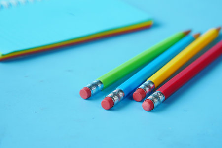 Close up of colorful pencils on notepadの写真素材