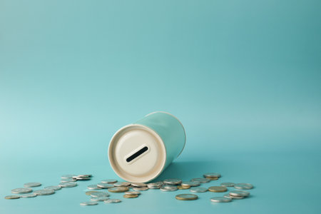saving coins jar and calculator on tableの写真素材