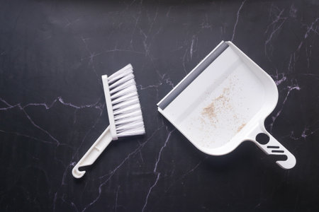 floor dust with dust pan close up ,の写真素材