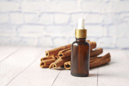 cinnamon essential oil in a container ,の写真素材