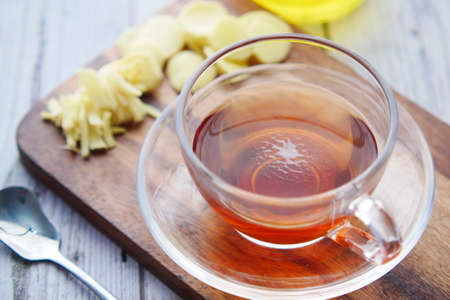 Top view of ginger tea on wooden background.の写真素材